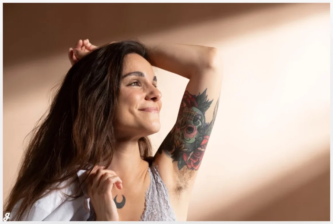 Portrait of beautiful woman posing in her bra with tattoo