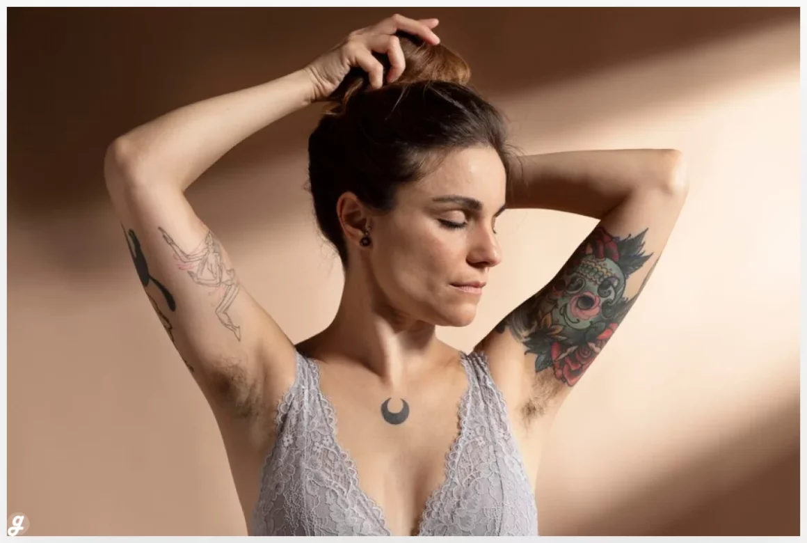 Portrait of beautiful woman posing in her bra with tattoo